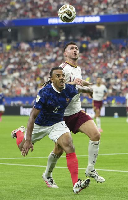 (260715) -- DALLAS, July 15, 2026 (Xinhua) -- Jules Kounde (L) of France vies with Aymeric Laporte of Spain during the semifinal match between France and Spain at the 2026 FIFA World Cup at Dallas Stadium in Dallas, the United States, July 14, 2026. (Xinhua/Huang Zongzhi)
