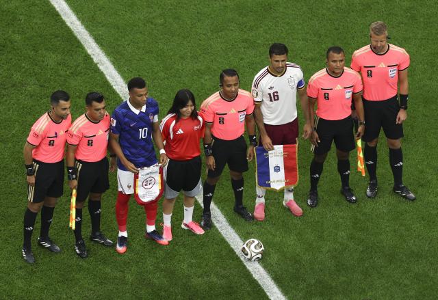 (260715) -- DALLAS, July 15, 2026 (Xinhua) -- Kylian Mbappe (3rd L) of France, Rodri (3rd R) of Spain and referees pose before the semifinal match between France and Spain at the 2026 FIFA World Cup at Dallas Stadium in Dallas, the United States, July 14, 2026. (Xinhua/Hu Xingyu)