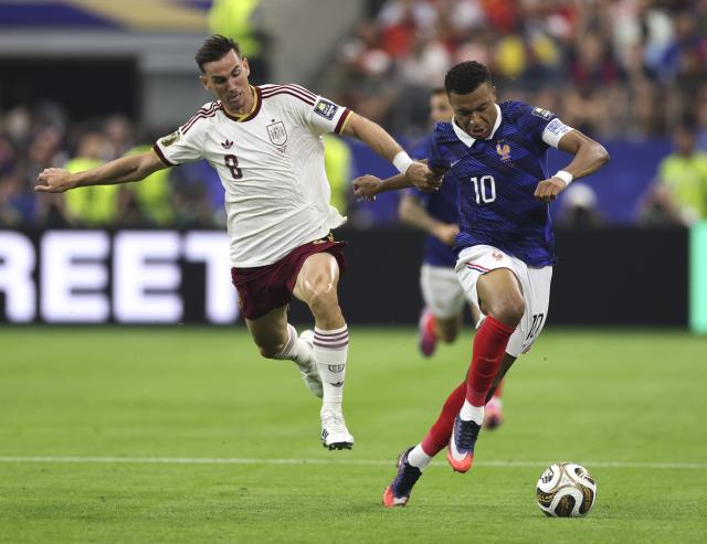 (260715) -- DALLAS, July 15, 2026 (Xinhua) -- Kylian Mbappe (R) of France vies with Fabian Ruiz of Spain during the semifinal match between France and Spain at the 2026 FIFA World Cup at Dallas Stadium in Dallas, the United States, July 14, 2026. (Xinhua/Xu Zijian)