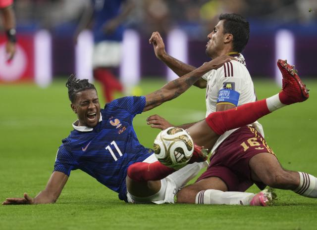 (260715) -- DALLAS, July 15, 2026 (Xinhua) -- Michael Olise (L) of France falls down during the semifinal match between France and Spain at the 2026 FIFA World Cup at Dallas Stadium in Dallas, the United States, July 14, 2026. (Xinhua/Wu Xiaoling)