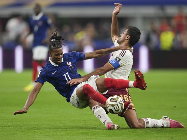 (260715) -- DALLAS, July 15, 2026 (Xinhua) -- Michael Olise (L) of France falls down during the semifinal match between France and Spain at the 2026 FIFA World Cup at Dallas Stadium in Dallas, the United States, July 14, 2026. (Xinhua/Wu Xiaoling)