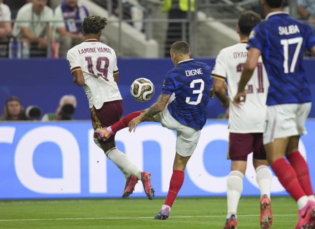(260715) -- DALLAS, July 15, 2026 (Xinhua) -- Lucas Digne (2nd L) of France fouls Lamine Yamal (1st L) of Spain during the semifinal match between France and Spain at the 2026 FIFA World Cup at Dallas Stadium in Dallas, the United States, July 14, 2026. (Xinhua/Wu Xiaoling)