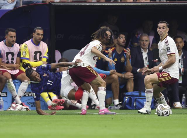 (260715) -- DALLAS, July 15, 2026 (Xinhua) -- Michael Olise (L front) of France falls down during the semifinal match between France and Spain at the 2026 FIFA World Cup at Dallas Stadium in Dallas, the United States, July 14, 2026. (Xinhua/Xu Zijian)