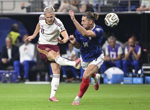 (260715) -- DALLAS, July 15, 2026 (Xinhua) -- Dani Olmo (L) of Spain shoots during the semifinal match between France and Spain at the 2026 FIFA World Cup at Dallas Stadium in Dallas, the United States, July 14, 2026. (Xinhua/Chen Yichen)