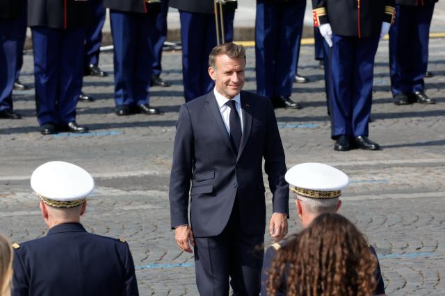 (260714) -- PARIS, July 14, 2026 (Xinhua) -- French President Emmanuel Macron attends the annual Bastille Day military parade in Paris, France, on July 14, 2026. (Photo by Henri Szwarc/Xinhua)