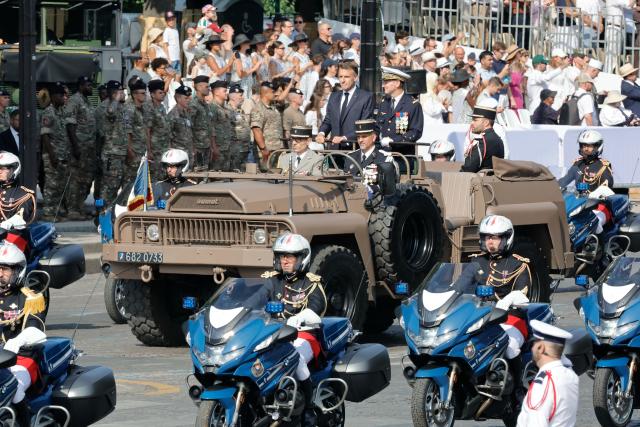 (260714) -- PARIS, July 14, 2026 (Xinhua) -- French President Emmanuel Macron attends the annual Bastille Day military parade in Paris, France, on July 14, 2026. (Photo by Henri Szwarc/Xinhua)