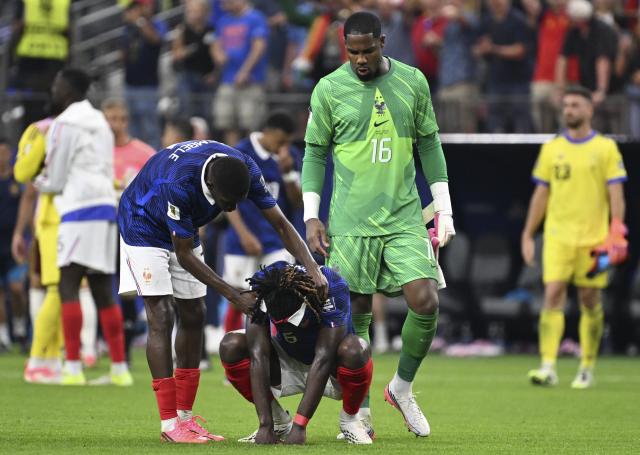 (260715) -- DALLAS, July 15, 2026 (Xinhua) -- Manu Kone (bottom) of France reacts after the semifinal match between France and Spain at the 2026 FIFA World Cup at Dallas Stadium in Dallas, the United States, July 14, 2026. (Xinhua/Chen Yichen)