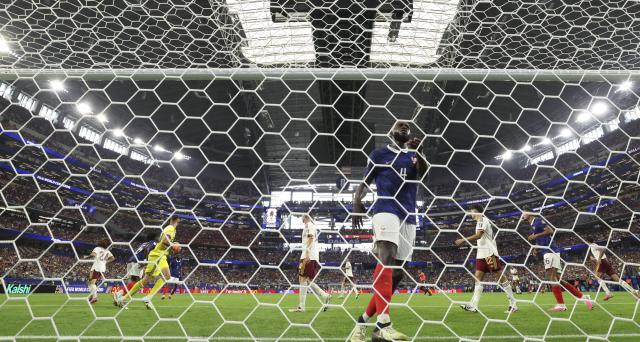 (260715) -- DALLAS, July 15, 2026 (Xinhua) -- Dayot Upamecano (front) of France reacts as he misses a chance during the semifinal match between France and Spain at the 2026 FIFA World Cup at Dallas Stadium in Dallas, the United States, July 14, 2026. (Xinhua/Chen Yichen)