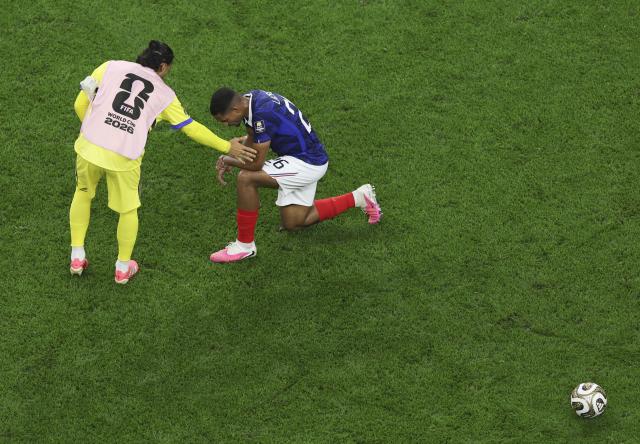 (260715) -- DALLAS, July 15, 2026 (Xinhua) -- Maxence Lacroix (R) of France reacts after the semifinal match between France and Spain at the 2026 FIFA World Cup at Dallas Stadium in Dallas, the United States, July 14, 2026. (Xinhua/Hu Xingyu)