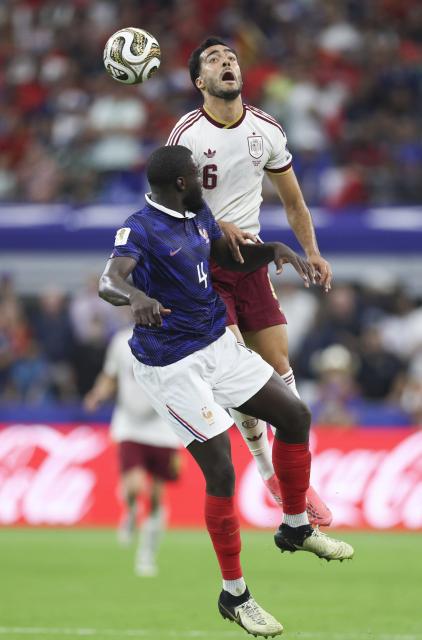 (260715) -- DALLAS, July 15, 2026 (Xinhua) -- Mikel Merino (R) of Spain jumps for a header against Dayot Upamecano of France during the semifinal match between France and Spain at the 2026 FIFA World Cup at Dallas Stadium in Dallas, the United States, July 14, 2026. (Xinhua/Xu Zijian)