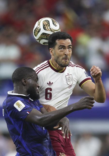 (260715) -- DALLAS, July 15, 2026 (Xinhua) -- Mikel Merino (R) of Spain jumps for a header against Dayot Upamecano of France during the semifinal match between France and Spain at the 2026 FIFA World Cup at Dallas Stadium in Dallas, the United States, July 14, 2026. (Xinhua/Xu Zijian)