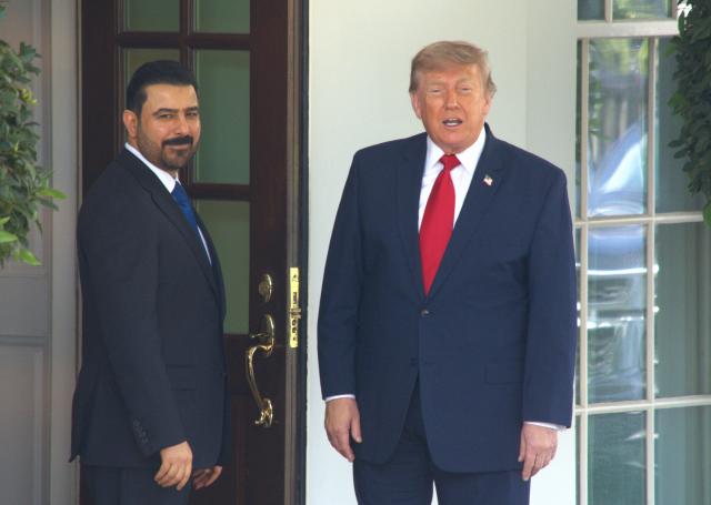 (260714) -- WASHINGTON, July 14, 2026 (Xinhua) -- U.S. President Donald Trump (R) welcomes Iraqi Prime Minister Ali al-Zaidi at the White House in Washington, D.C., the United States, July 14, 2026. Trump said Tuesday that the United States will take investment deals with Gulf states instead of fees for ships passing through the Strait of Hormuz. (Photo by Li Yuanqing/Xinhua)