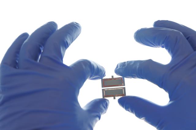 (260715) -- BEIJING, July 15, 2026 (Xinhua) -- A researcher demonstrates the high-performance perovskite-organic tandem solar cell device at a laboratory of the Institute of Chemistry, Chinese Academy of Sciences (ICCAS), in Beijing, capital of China, July 3, 2026. A new type of solar cell developed by a team of Chinese scientists has achieved a certified steady-state power conversion efficiency of 28.04 percent, setting a new world record for this class of solar cells. 
  The team, led by Li Yongfang, an academician at the Institute of Chemistry, Chinese Academy of Sciences, and Meng Lei, a researcher from the institute, developed the high-performance perovskite-organic tandem solar cell by incorporating a photo-transformable stabilizer. The study was published online in Nature on Monday. (Xinhua/Jin Liwang)