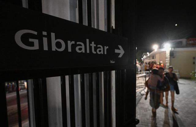 (260715) -- GIBRALTAR, July 15, 2026 (Xinhua) -- People walk across the land border port between Gibraltar and Spain on July 15, 2026. The European Union (EU) and Britain on Tuesday formally signed an agreement in respect of Gibraltar in Brussels, removing routine checks at the land border between Gibraltar and Spain. 
   Under the agreement, the movement of goods and workers between Gibraltar and Spain will be significantly facilitated, boosting economic links between Gibraltar and the EU. (Xinhua/Cheng Min)