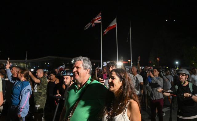 (260715) -- GIBRALTAR, July 15, 2026 (Xinhua) -- People walk across the land border port between Gibraltar and Spain on July 15, 2026. The European Union (EU) and Britain on Tuesday formally signed an agreement in respect of Gibraltar in Brussels, removing routine checks at the land border between Gibraltar and Spain. 
   Under the agreement, the movement of goods and workers between Gibraltar and Spain will be significantly facilitated, boosting economic links between Gibraltar and the EU. (Xinhua/Cheng Min)