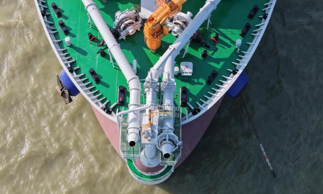 (260715) -- GUANGZHOU, July 15, 2026 (Xinhua) -- An aerial drone photo taken on May 27, 2026 shows the adjustable dual bow jetting system of the "Junguang" dredger at the Pearl River Estuary area, in south China's Guangdong Province. The "Junguang," a mega dredger with a 35,000 cubic meter capacity, was recently put into operation. Measuring 198 meters in length, with a maximum dredging depth of 120 meters and a deadweight of 60,483 tonnes, the vessel is the largest of its kind in Asia. 
  The vessel is equipped with the self-developed intelligent dredging control systems. It is capable of exceptional performance, including strong soil penetration, deep dredging, long-distance transport, and extended blowing capabilities. It is expected to be widely used in port and waterway dredging, deep-sea sand extraction, land reclamation, deep-sea mining, trench excavation and backfilling, gravel bed construction, and deep-sea pipeline laying. (Xinhua/Deng Hua)