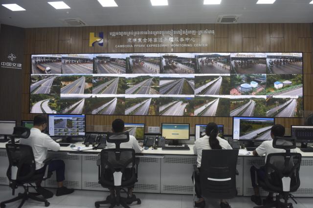 (260715) -- PHNOM PENH, July 15, 2026 (Xinhua) -- Staff members work at the monitoring center of the Phnom Penh-Sihanoukville Expressway in Phnom Penh, Cambodia, on July 14, 2026. The Chinese-invested Phnom Penh-Sihanoukville Expressway has not only enhanced travel and freight efficiency, but has also become a platform for promoting road safety in Cambodia.
   TO GO WITH "Roundup: Chinese-operated expressway advances road safety, awareness in Cambodia" (Photo by Vanpov/Xinhua)