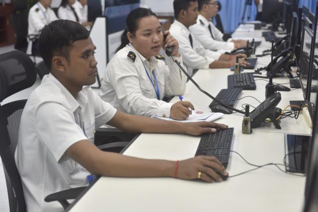 (260715) -- PHNOM PENH, July 15, 2026 (Xinhua) -- Staff members work at the monitoring center of the Phnom Penh-Sihanoukville Expressway in Phnom Penh, Cambodia, on July 14, 2026. The Chinese-invested Phnom Penh-Sihanoukville Expressway has not only enhanced travel and freight efficiency, but has also become a platform for promoting road safety in Cambodia.
   TO GO WITH "Roundup: Chinese-operated expressway advances road safety, awareness in Cambodia" (Photo by Vanpov/Xinhua)