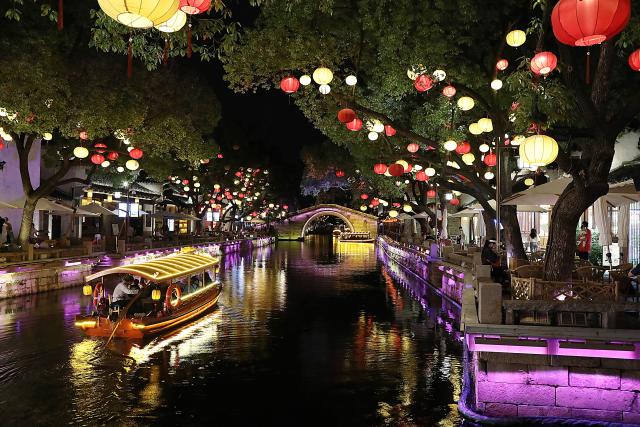 (260715) -- BEIJING, July 15, 2026 (Xinhua) -- People enjoy the night scenery in Huishan Yingyueli area in Wuxi City, east China's Jiangsu Province on July 2, 2026. (Xinhua/Lu Peng)