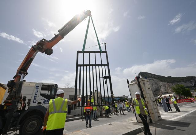 (260715) -- GIBRALTAR, July 15, 2026 (Xinhua) -- Workers dismantle the border fence with a crane at the Spain-Gibraltar land crossing on July 15, 2026. Routine border checks at the Spain-Gibraltar land crossing were lifted in the early hours of Wednesday, in line with new border arrangements under the post-Brexit agreement between the European Union and Britain.
The agreement, signed in Brussels on Tuesday, began provisional application on Wednesday and remains subject to the consent of the European Parliament and the completion of ratification procedures by both sides. (Xinhua/Cheng Min)