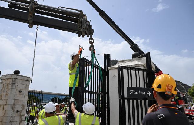(260715) -- GIBRALTAR, July 15, 2026 (Xinhua) -- A border check fence is lifted at the land border crossing between Gibraltar and Spain, on July 15, 2026. Routine border checks at the Spain-Gibraltar land crossing were lifted in the early hours of Wednesday, in line with new border arrangements under the post-Brexit agreement between the European Union and Britain.
   The agreement, signed in Brussels on Tuesday, began provisional application on Wednesday and remains subject to the consent of the European Parliament and the completion of ratification procedures by both sides. (Xinhua/Cheng Min)