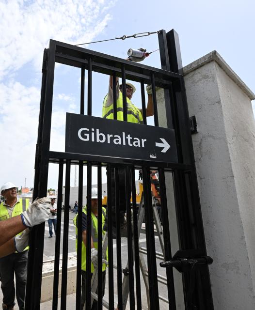 (260715) -- GIBRALTAR, July 15, 2026 (Xinhua) -- Workers dismantle the border fence at the Spain-Gibraltar land crossing on July 15, 2026. Routine border checks at the Spain-Gibraltar land crossing were lifted in the early hours of Wednesday, in line with new border arrangements under the post-Brexit agreement between the European Union and Britain.
The agreement, signed in Brussels on Tuesday, began provisional application on Wednesday and remains subject to the consent of the European Parliament and the completion of ratification procedures by both sides. (Xinhua/Cheng Min)