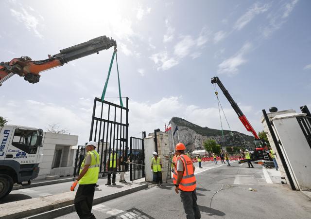 (260715) -- GIBRALTAR, July 15, 2026 (Xinhua) -- Workers dismantle the border fence with a crane at the Spain-Gibraltar land crossing on July 15, 2026. Routine border checks at the Spain-Gibraltar land crossing were lifted in the early hours of Wednesday, in line with new border arrangements under the post-Brexit agreement between the European Union and Britain.
The agreement, signed in Brussels on Tuesday, began provisional application on Wednesday and remains subject to the consent of the European Parliament and the completion of ratification procedures by both sides. (Xinhua/Cheng Min)