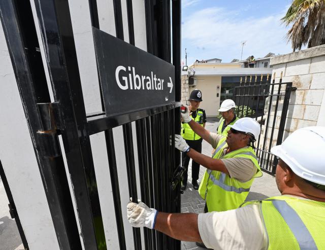 (260715) -- GIBRALTAR, July 15, 2026 (Xinhua) -- Workers dismantle the border fence at the Spain-Gibraltar land crossing on July 15, 2026. Routine border checks at the Spain-Gibraltar land crossing were lifted in the early hours of Wednesday, in line with new border arrangements under the post-Brexit agreement between the European Union and Britain.
The agreement, signed in Brussels on Tuesday, began provisional application on Wednesday and remains subject to the consent of the European Parliament and the completion of ratification procedures by both sides. (Xinhua/Cheng Min)