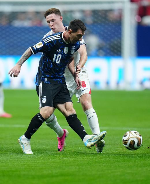 (260716) -- ATLANTA, July 16, 2026 (Xinhua) -- Lionel Messi (Front) of Argentina vies with Elliot Anderson of England during the semifinal match between Argentina and England at the 2026 FIFA World Cup at Atlanta Stadium in Atlanta, the United States, July 15, 2026. (Xinhua/Jia Haocheng)
