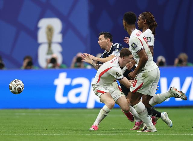 (260716) -- ATLANTA, July 16, 2026 (Xinhua) -- Lionel Messi (2nd L) of Argentina is fouled during the semifinal match between Argentina and England at the 2026 FIFA World Cup at Atlanta Stadium in Atlanta, the United States, July 15, 2026. (Xinhua/Li Ming)