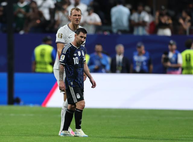 (260716) -- ATLANTA, July 16, 2026 (Xinhua) -- Lionel Messi (front) of Argentina and Dan Burn of England react during the semifinal match between Argentina and England at the 2026 FIFA World Cup at Atlanta Stadium in Atlanta, the United States, July 15, 2026. (Xinhua/Cao Can)