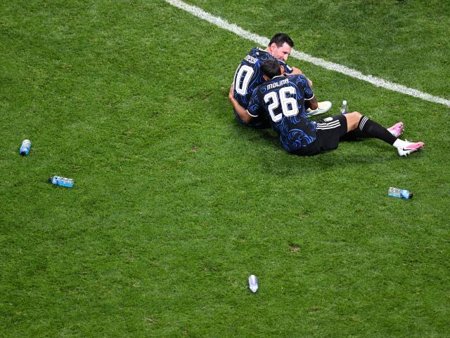 (260716) -- ATLANTA, July 16, 2026 (Xinhua) -- Lionel Messi (L) and Nahuel Molina of Argentina react after the semifinal match between Argentina and England at the 2026 FIFA World Cup at Atlanta Stadium in Atlanta, the United States, July 15, 2026. (Xinhua/Xiao Yijiu)