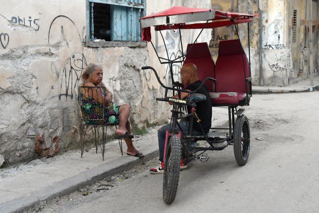 (260715) -- HAVANA, July 15, 2026 (Xinhua) -- People chat on the street during a nationwide blackout in Havana, capital of Cuba, July 14, 2026. Cuba was hit by a third nationwide blackout in a little over a week on Tuesday, the National Electric Union said. (Photo by Joaquin Hernandez/Xinhua)