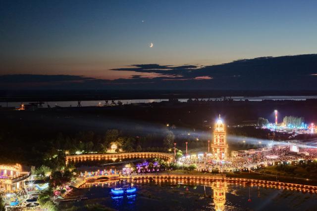 (260718) -- HARBIN, July 18, 2026 (Xinhua) -- A drone photo taken on July 17, 2026 shows the moon and Venus in Tongjiang City, northeast China's Heilongjiang Province. (Photo by Li Wenbin/Xinhua)