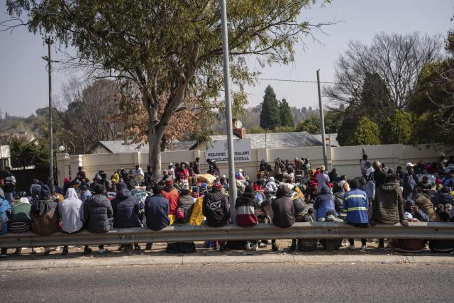 (260718) -- JOHANNESBURG, July 18, 2026 (Xinhua) -- Malawians wait outside the Malawian consulate in Johannesburg, South Africa, July 13, 2026. TO GO WITH "Feature: As migrants await repatriation, South Africa faces persistent anti-immigration tensions" (Photo by Ihsaan Haffejee/Xinhua)