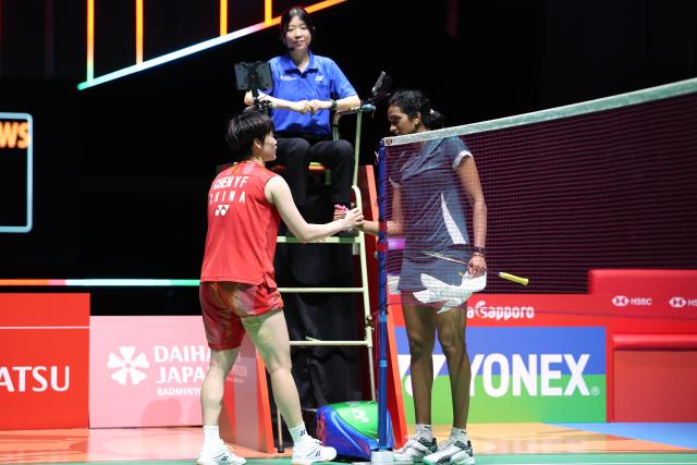 (260718) -- TOKYO, July 18, 2026 (Xinhua) -- Chen Yufei (L) and Pusarla V. Sindhu greet each other after the women's singles semifinal match between Chen Yufei of China and Pusarla V. Sindhu of India at the Japan Badminton Open 2026 in Tokyo, Japan, July 18, 2026.
   Chen retired from the match due to injury. (Xinhua/Yue Chenxing)