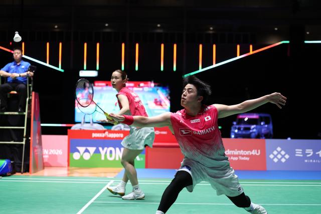 (260718) -- TOKYO, July 18, 2026 (Xinhua) -- Koga Akira (R)/Saito Natsu compete during the mixed doubles semifinal match between Feng Yanzhe/Huang Dongping of China and Koga Akira/Saito Natsu of Japan at the Japan Badminton Open 2026 in Tokyo, Japan, July 18, 2026. (Xinhua/Yue Chenxing)