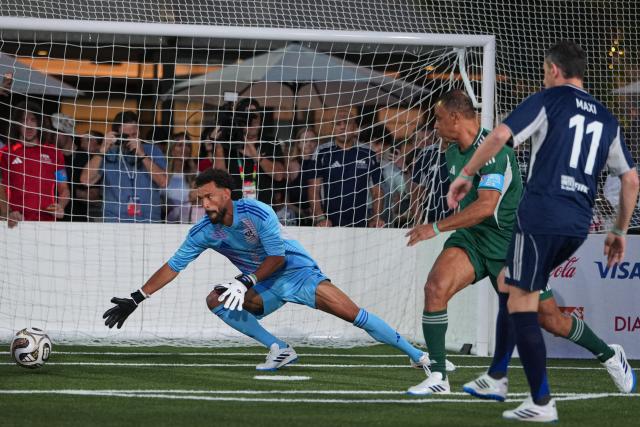 (260718) -- NEW YORK, July 18, 2026 (Xinhua) -- Cabo Verde's goalkeeper Vozinha (L) makes a save during a FIFA Legends Cup match held ahead of the final match between Argentina and Spain at the 2026 FIFA World Cup at Rockefeller Center in New York, the United States, July 17, 2026. (Xinhua/Huang Zongzhi)