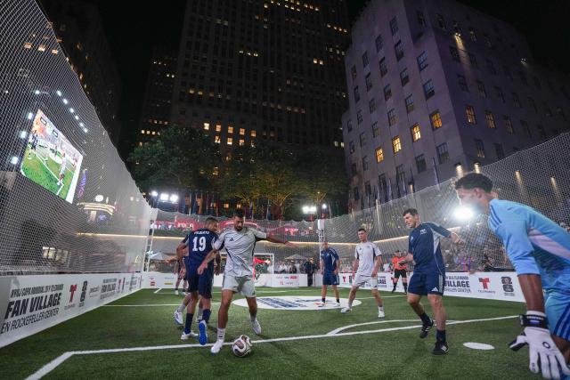 (260718) -- NEW YORK, July 18, 2026 (Xinhua) -- Serbian tennis player Novak Djokovic (2nd L) competes during a FIFA Legends Cup match held ahead of the final match between Argentina and Spain at the 2026 FIFA World Cup at Rockefeller Center in New York, the United States, July 17, 2026. (Xinhua/Huang Zongzhi)