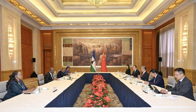 (260718) -- SHANGHAI, July 18, 2026 (Xinhua) -- Chinese Foreign Minister Wang Yi, also a member of the Political Bureau of the Communist Party of China Central Committee, meets with Limpho Tau, minister of foreign affairs and international relations of Lesotho, who is attending the 2026 World Artificial Intelligence Conference, in Shanghai, east China, July 18, 2026. (Xinhua/Chen Haoming)