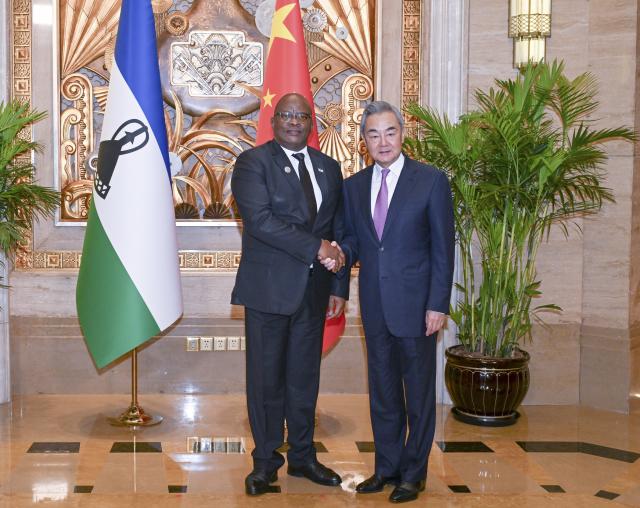 (260718) -- SHANGHAI, July 18, 2026 (Xinhua) -- Chinese Foreign Minister Wang Yi, also a member of the Political Bureau of the Communist Party of China Central Committee, meets with Limpho Tau, minister of foreign affairs and international relations of Lesotho, who is attending the 2026 World Artificial Intelligence Conference, in Shanghai, east China, July 18, 2026. (Xinhua/Chen Haoming)