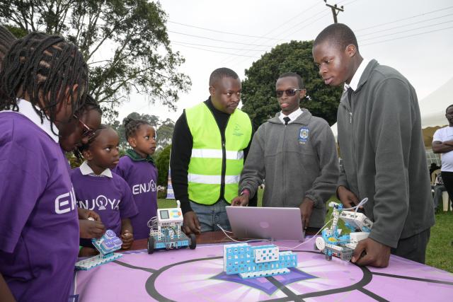 (260718) -- NAIROBI, July 18, 2026 (Xinhua) -- Students (1st R and 2nd R) adjust a robot during an artificial intelligence (AI)-enabled coding and robotics competition in Kiambu county, central Kenya, July 17, 2026. More than 200 young learners participated in the competition here on Friday.
   TO GO WITH "Kenya launches AI-powered coding competition for schoolchildren" (Xinhua/Yang Guang)