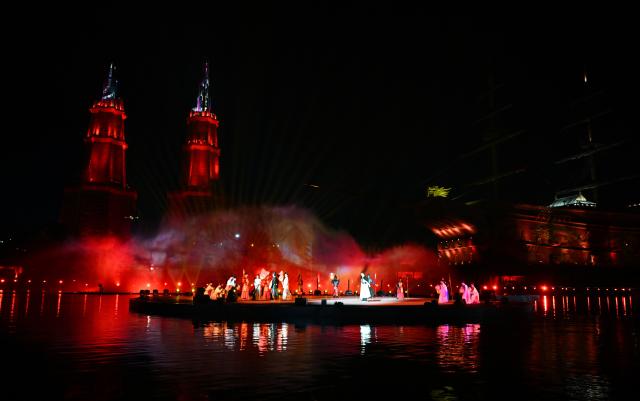 (260718) -- HAIKOU, July 18, 2026 (Xinhua) -- Actors perform during the opening ceremony of 2026 Hainan Island Carnival in Haikou, south China's Hainan Province, July 18, 2026. The 2026 Hainan Island Carnival opened here on Saturday and will last until Aug. 18, during which over 50 special events will be held. (Xinhua/Guo Cheng)
