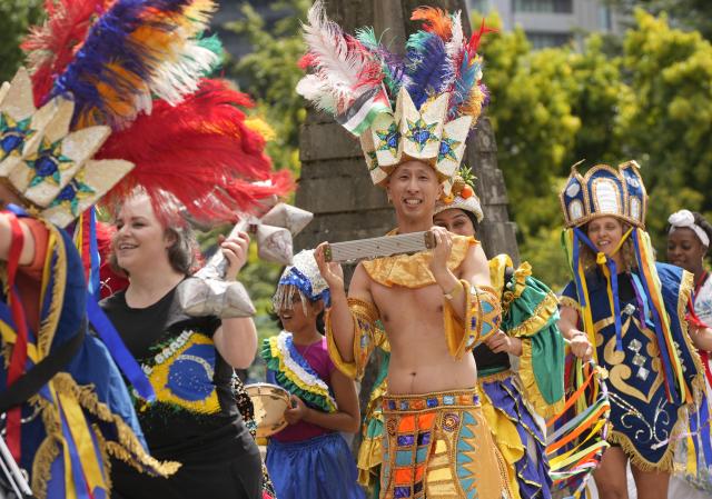 (260719) -- SURREY, July 19, 2026 (Xinhua) -- Participants in traditional costumes march during the Parade of Cultures at the Fusion Festival in Surrey, British Columbia, Canada, July 18, 2026.
  The two-day festival, which opened here on Saturday, featured over 50 cultural pavilions offering food, music, dance, and cultural performances from around the world. (Photo by Liang Sen/Xinhua)