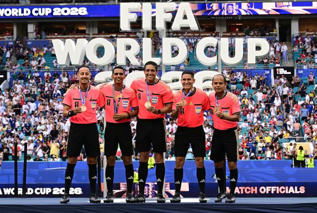 (260719) -- MIAMI, July 19, 2026 (Xinhua) -- Referees pose for photos on the podium after the bronze final match between France and England at the 2026 FIFA World Cup in Miami, the United States, July 18, 2026. (Xinhua/Chen Yichen)