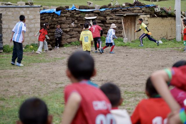 (260719) -- LHASA, July 19, 2026 (Xinhua) -- Players compete in a match in Zangbi Township of Lhari County, Nagqu, southwest China's Xizang Autonomous Region, July 18, 2026.
  TO GO WITH "Letter from Lhasa: Football dreams at an altitude of 4,700 meters" (Xinhua/Zhou Yulong)
