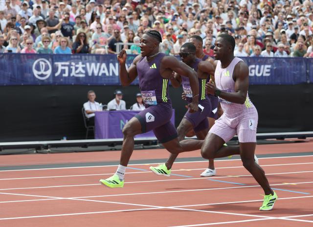 (260719) -- LONDON, July 19, 2026 (Xinhua) -- Nigeria's Kayinsola Ajayi (L) competes during the men's 100m final at the 2026 World Athletics Diamond League in London, Britain, on July 18, 2026. (Xinhua/Li Ying)