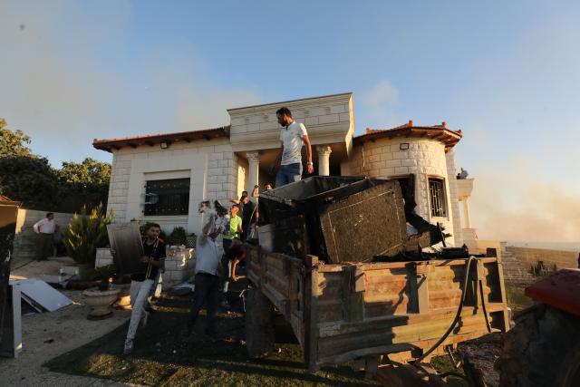 (260719) -- NABLUS, July 19, 2026 (Xinhua) -- Palestinians inspect damages after Israeli settlers set fire to a house in the town of Tell, southwest of Nablus in the West Bank, on July 18, 2026. (Photo by Nidal Eshtayeh/Xinhua)
