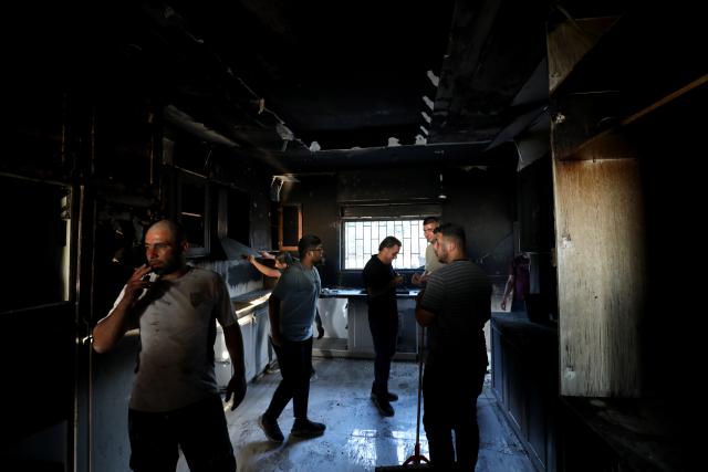 (260719) -- NABLUS, July 19, 2026 (Xinhua) -- Palestinians inspect damages after Israeli settlers set fire to a house in the town of Tell, southwest of Nablus in the West Bank, on July 18, 2026. (Photo by Nidal Eshtayeh/Xinhua)