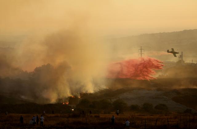 (260719) -- NABLUS, July 19, 2026 (Xinhua) -- This photo taken on July 18, 2026 shows fire set by Israeli settlers to the fields in the town of Tell, southwest of Nablus in the West Bank. (Photo by Nidal Eshtayeh/Xinhua)
